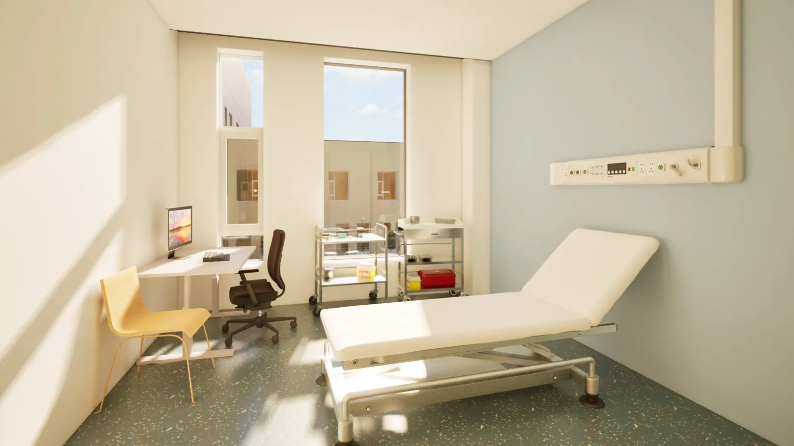 Et sykehusrom med seng og skrivebord