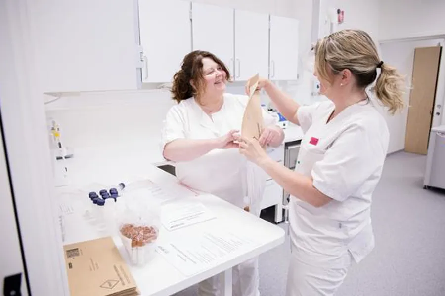 A couple of women in white coats